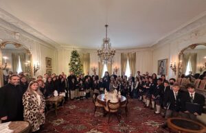 Greek-American Day School students sing carols to the Archbishop